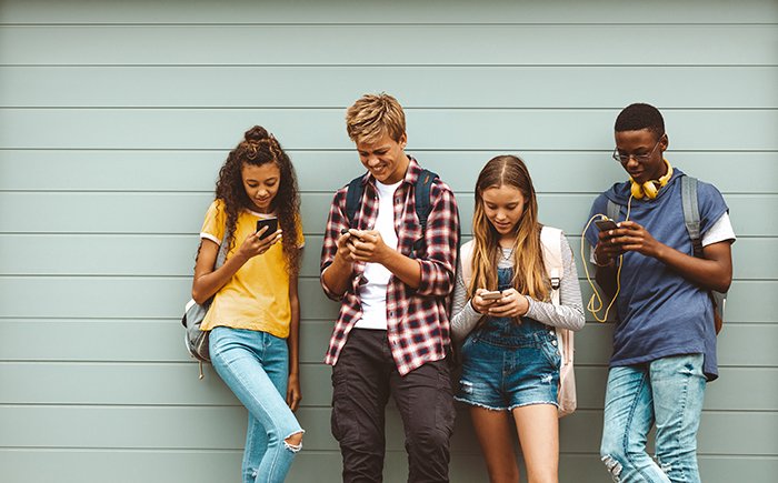 Teenagers on their phones