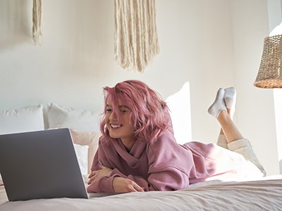 girl laughing on computer