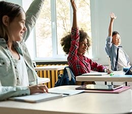 Students raising hands