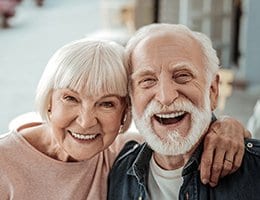 Husband and wife smiling