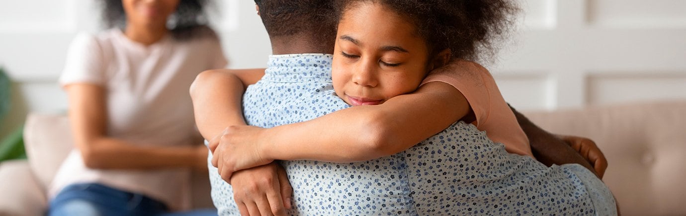 Dad and daughter hugging