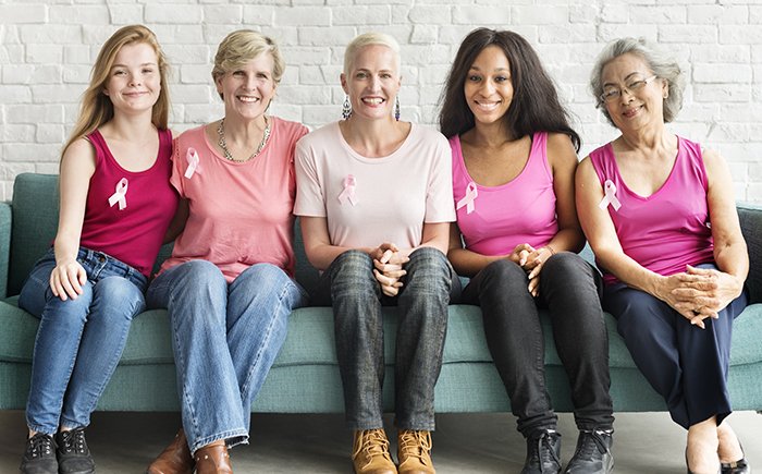 women with breast cancer awareness ribbons