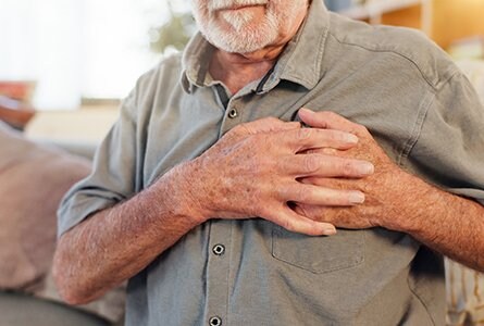 Man with his hand over his heart