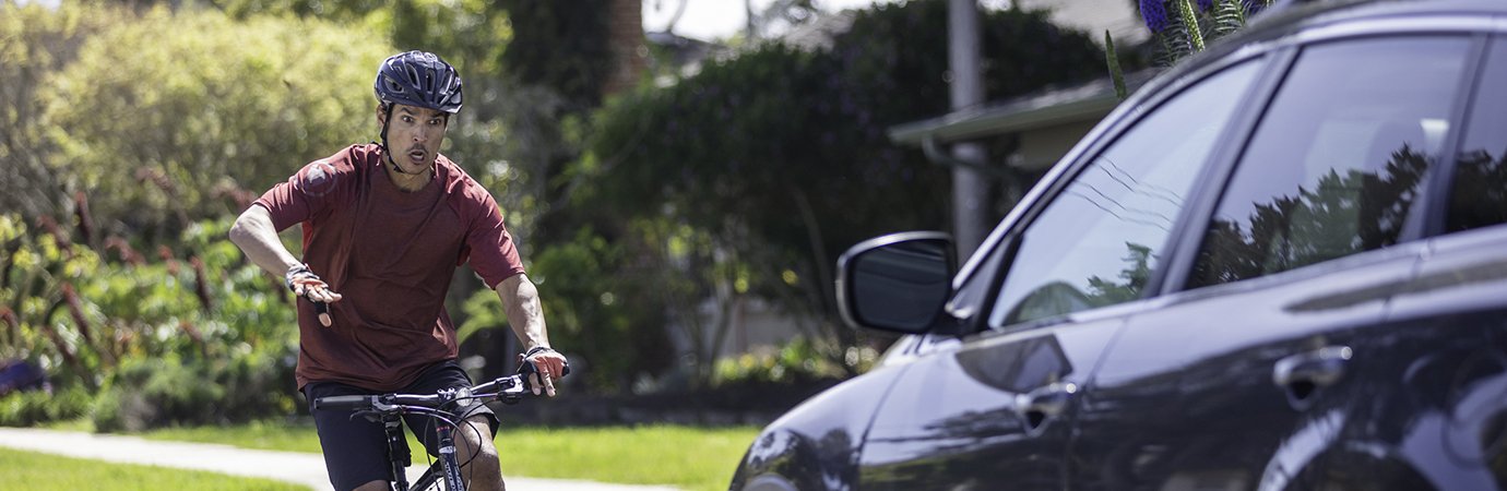 Man crashing his bike into car